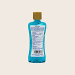 Blue bottle with a gold cap on a beige background