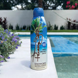 Panama Jack sunscreen spray bottle with palm tree design by a poolside