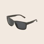 Panama Jack Sunglasses with dark lenses and black frame on a beige background