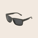 Panama Jack Sunglasses with dark lenses and black frame on a beige background