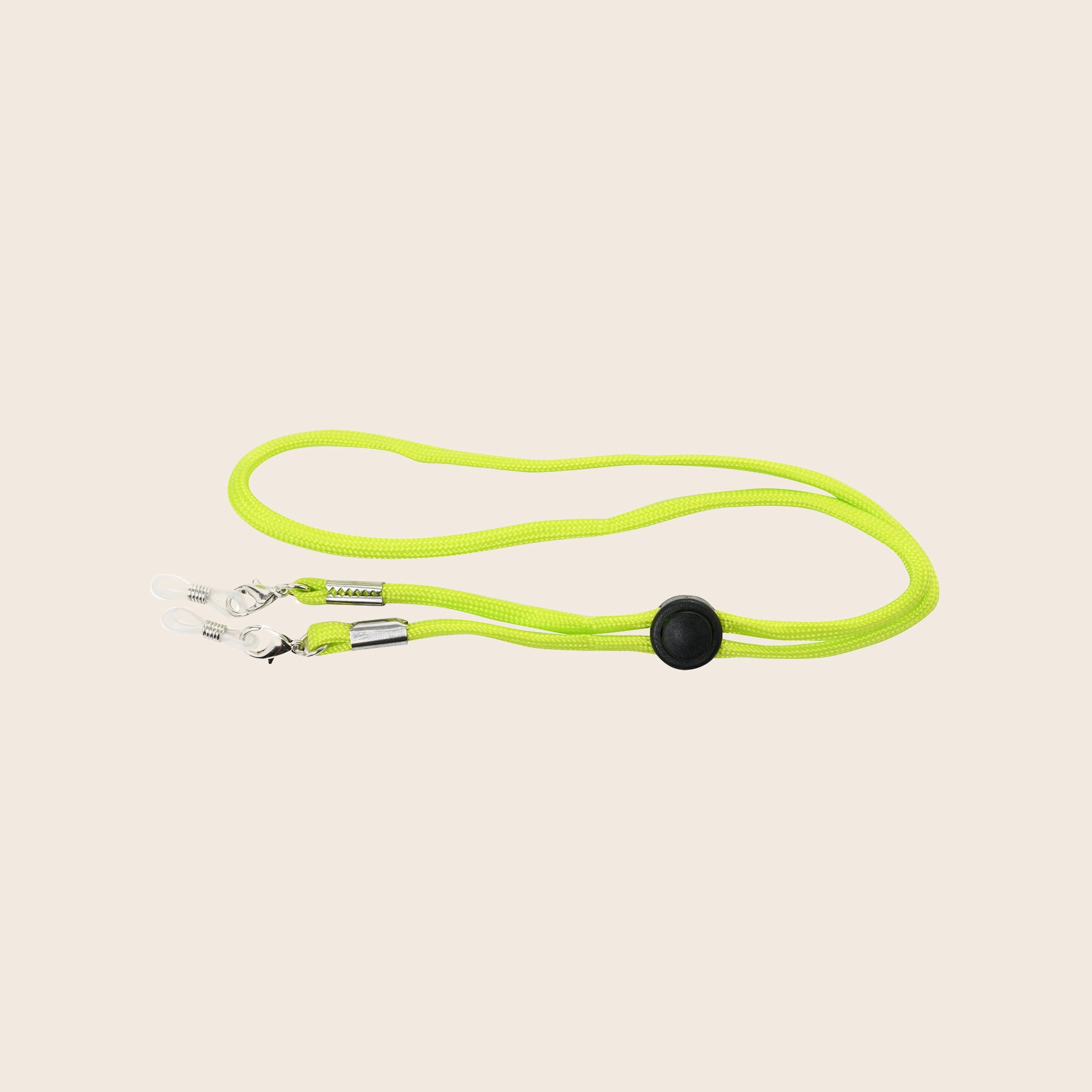 Neon green Panama jack sunglasses cord with a clip on a beige background