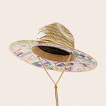 Panama Jack Straw hat with colorful patterned band on a beige background