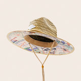 Panama Jack Straw hat with colorful patterned band on a beige background