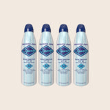Four bottles of Panama Jack Sport sunscreen spray on a beige background