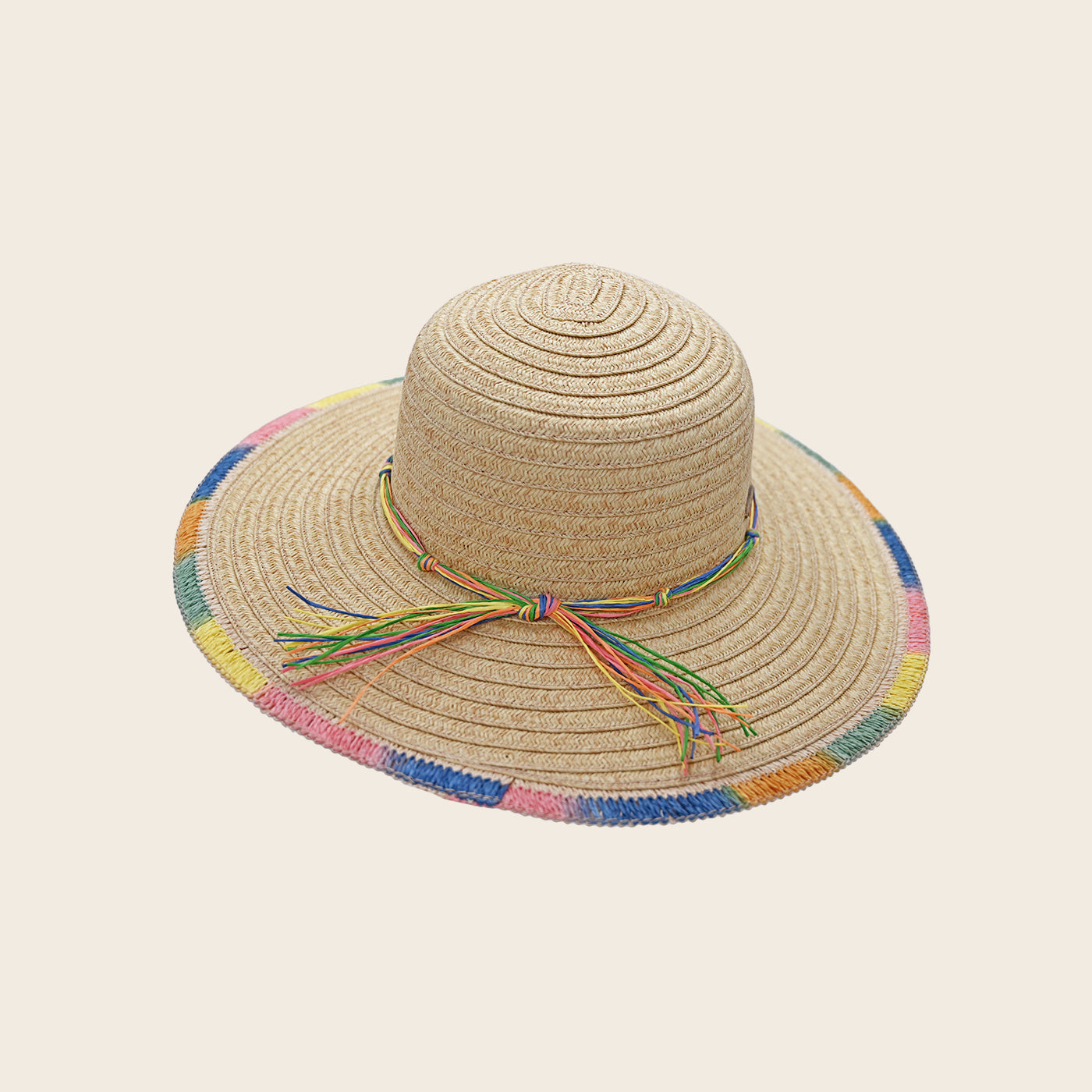 Beige straw Panama Jack hat with colorful band on a beige background