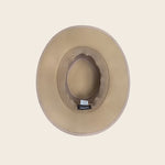 Beige straw Panama Jack hat on a beige background