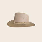 Beige straw Panama Jack hat with braided band on a beige background