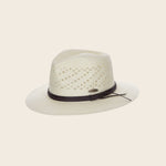 White Panama Jack straw hat with a black band on a beige background