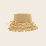 Beige straw Panama Jack hat with fringes on a beige background