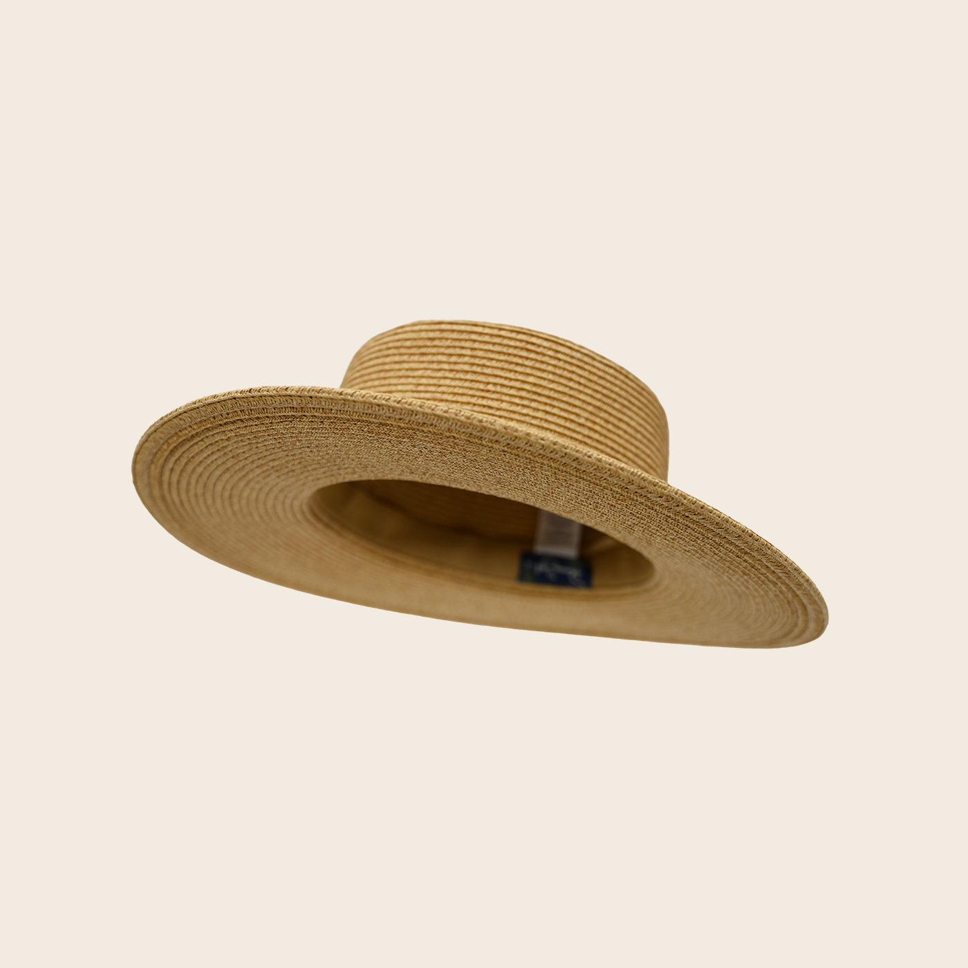 Beige straw Panama Jack hat on a beige background