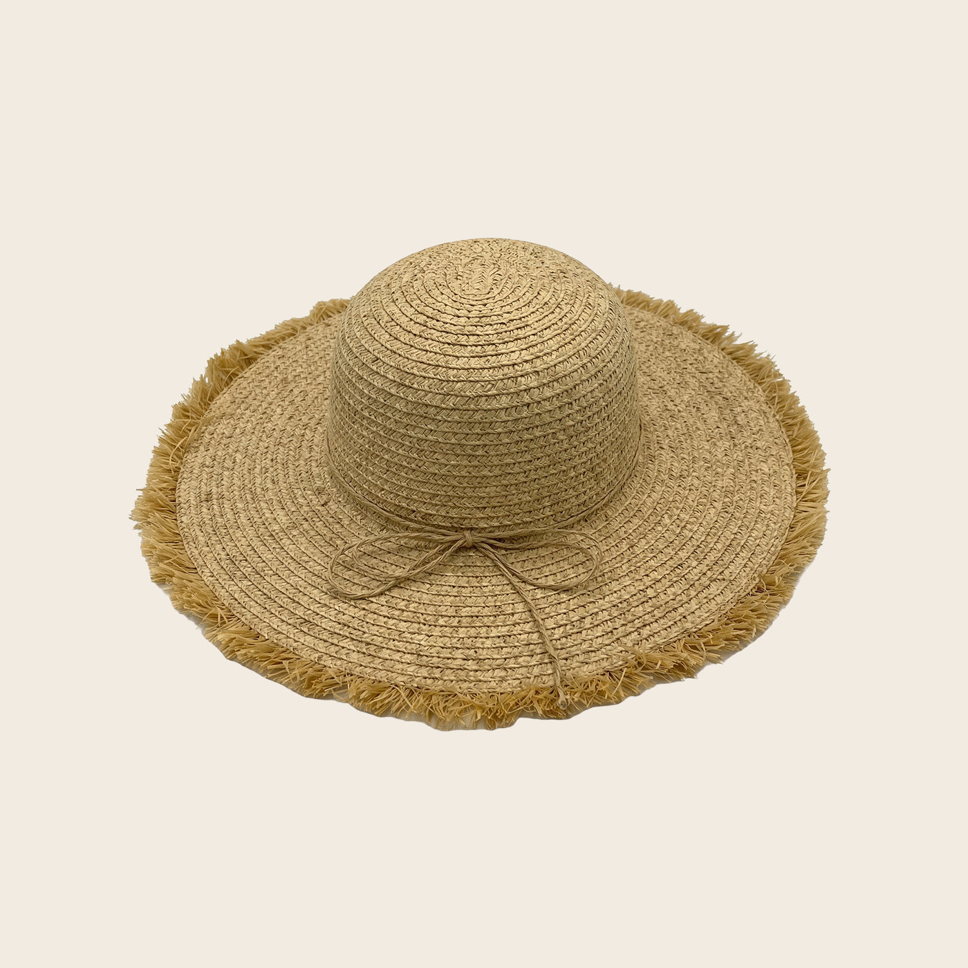 Beige straw Panama Jack hat with a wide brim on a beige background