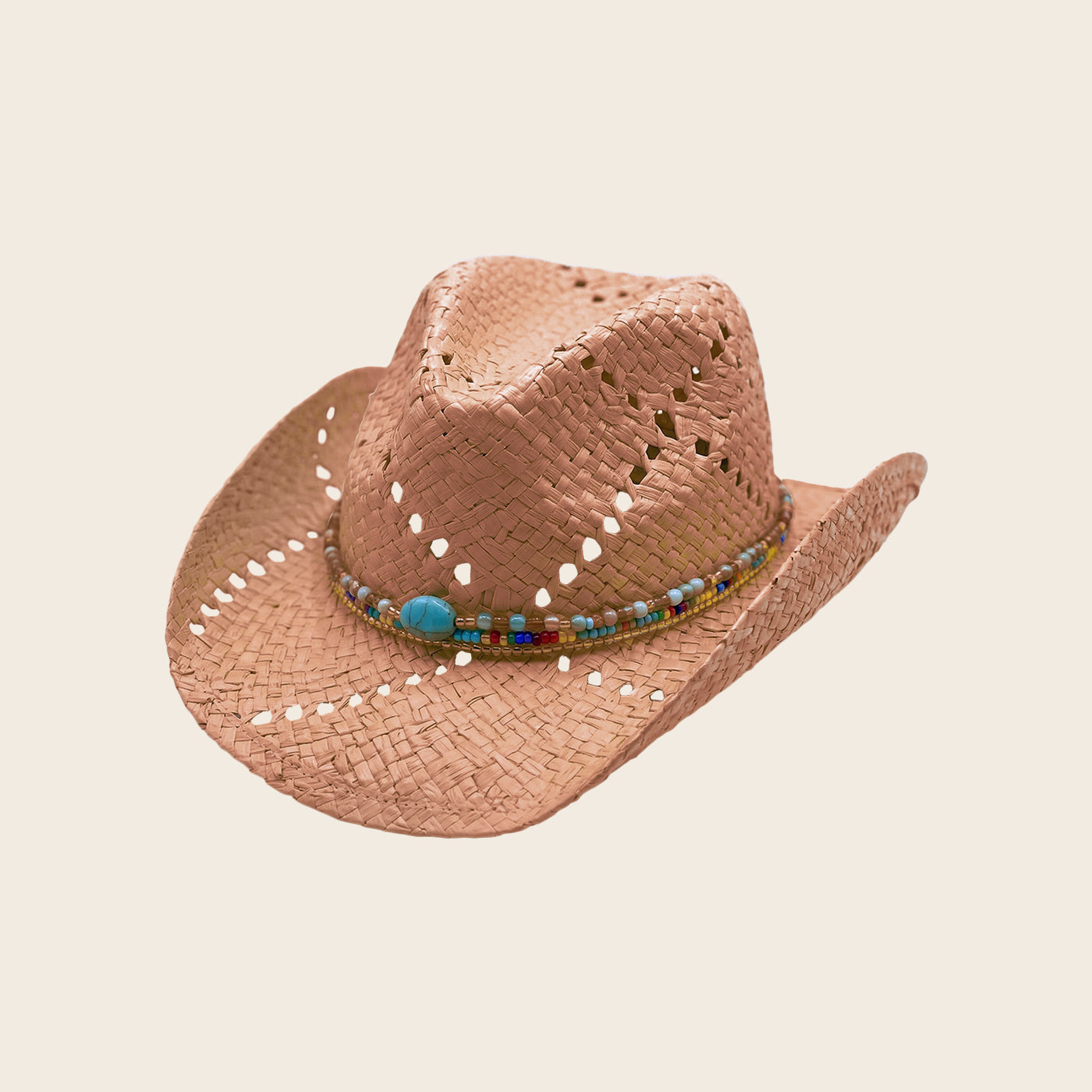 Brown straw cowboy Panama Jack hat with decorative band on a beige background