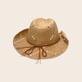 Straw Panama Jack hat with a ribbon on a beige background