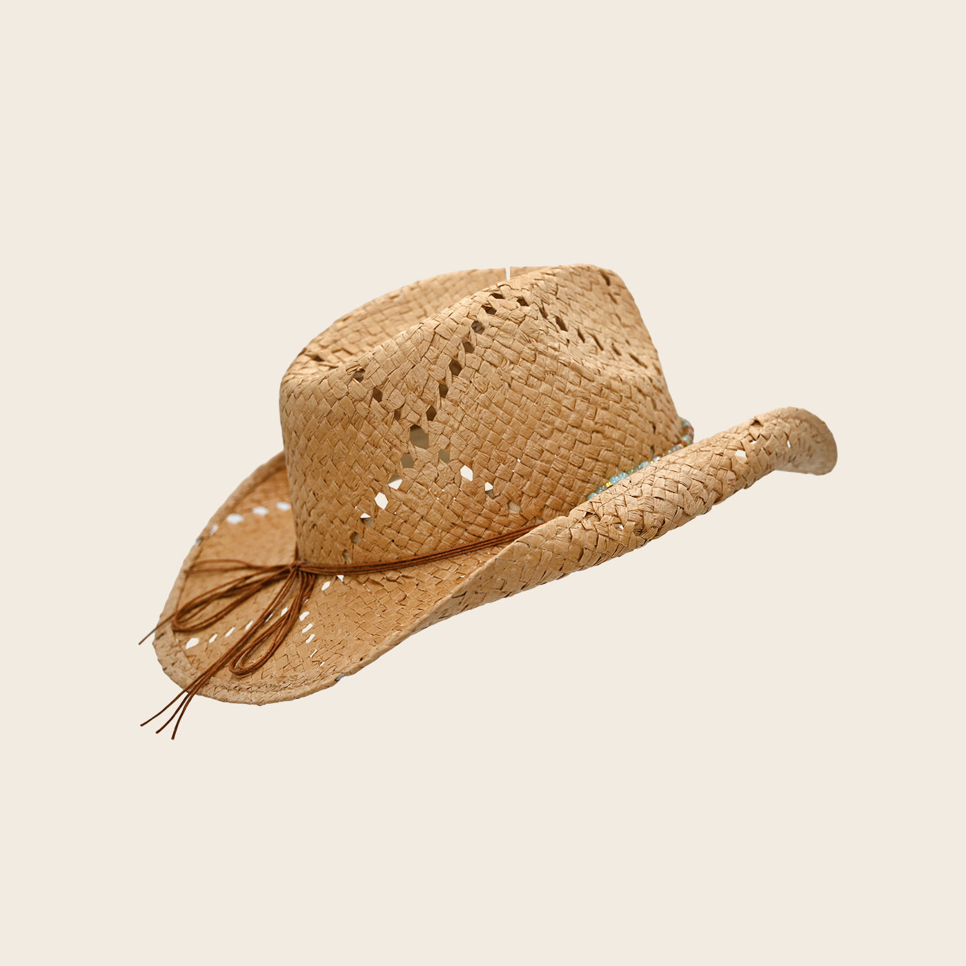 Straw cowboy Panama Jack hat with a band on a beige background