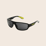 Black Panama Jack sunglasses with a yellow accent on a beige background